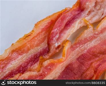 Fresh crispy bacon slices. macro shot. food background. Top view