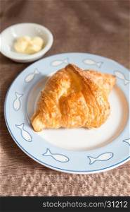 Fresh croissant and tasty butter for breakfast