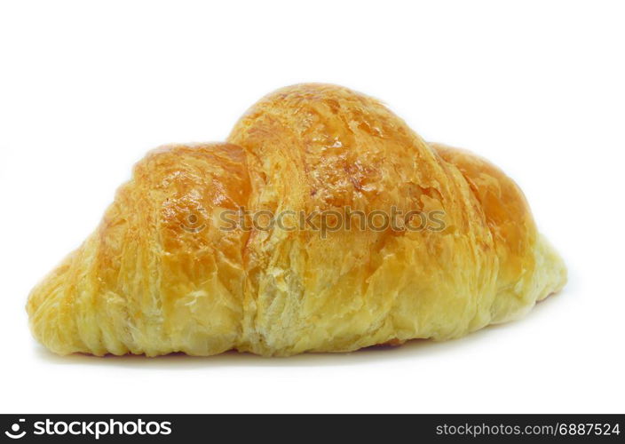 Fresh Croissant isolated on white background. Croissant is a French crescent-shaped roll made of sweet flaky pastry often eaten for breakfast.