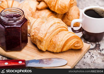 Fresh Croissants on wooden rustic background. Fresh Croissants