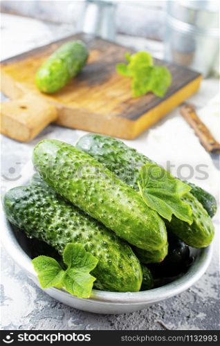 fresh cucumbers in bowl on a table