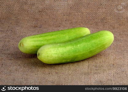 Fresh cucumbers on sack cloth