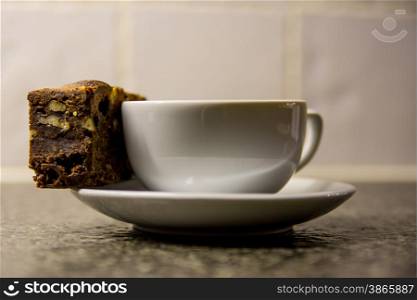 fresh cup of coffee with a brownie