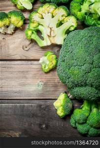 Fresh cut broccoli. On a wooden background.. Fresh cut broccoli.