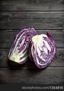 Fresh cut cabbage. On a wooden background.. Fresh cut cabbage.