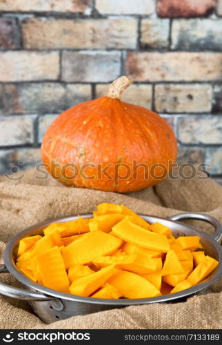 Fresh cut pumpkin on an old canvas