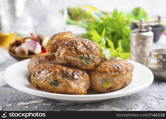fresh cutlets on plate on a table