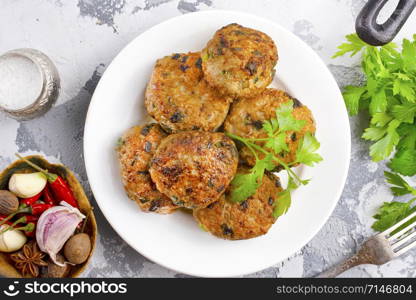 fresh cutlets on plate on a table