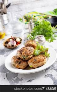 fresh cutlets on plate on a table