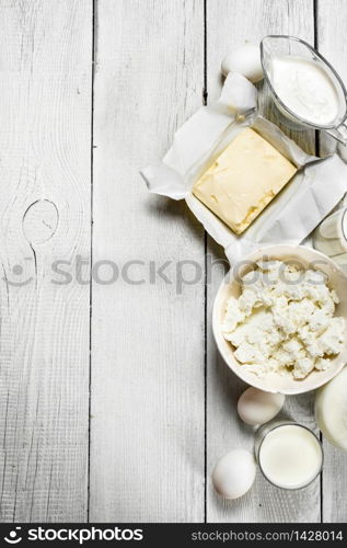 Fresh dairy products on white wooden background.. Fresh dairy products