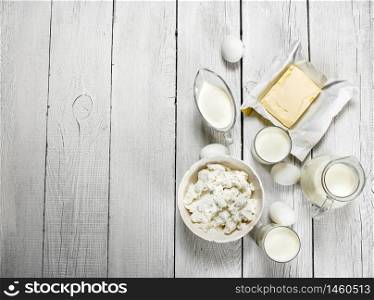 Fresh dairy products on white wooden background.. Fresh dairy products