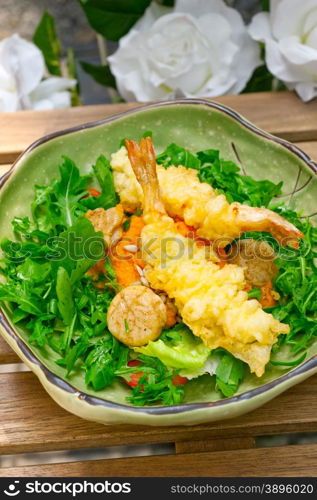 fresh deep fried Japanese tempura shrimps with salad and sea urchin