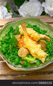 fresh deep fried Japanese tempura shrimps with salad and sea urchin