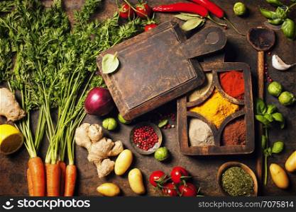 Fresh delicious ingredients for healthy cooking on rustic background. Diet, cooking, clean eating or vegetarian food concept.