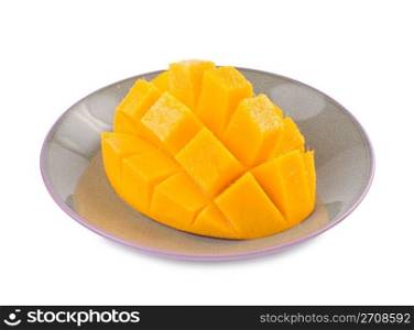 Fresh delicious mango fruit in dish, tropical fruit.