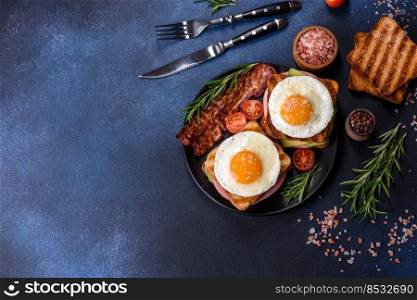 Fresh, delicious sandwiches with fried egg, ham, butter, avocado and sesame seeds on a wooden cutting board. Delicious healthy food. Fresh, delicious sandwiches with fried egg, ham, butter, avocado and sesame seeds