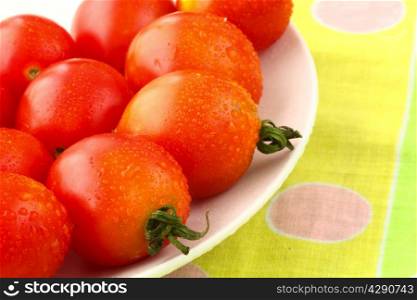 fresh domestic tomatoes in a white bowl