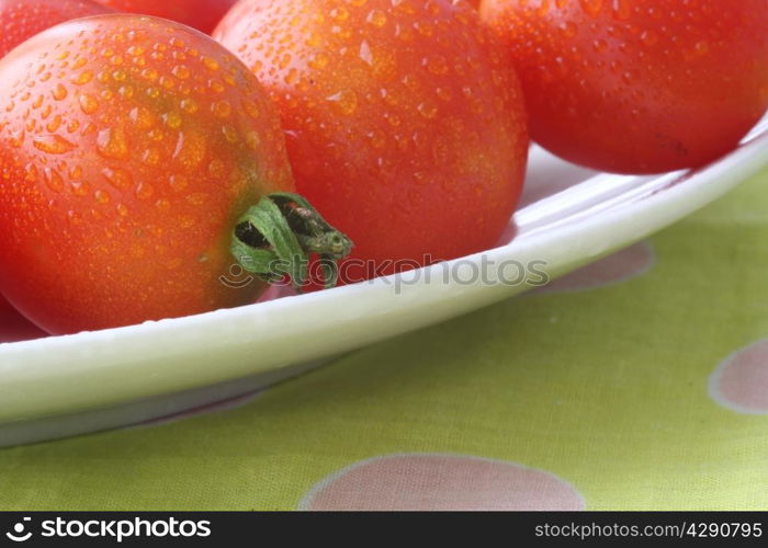 fresh domestic tomatoes in a white bowl