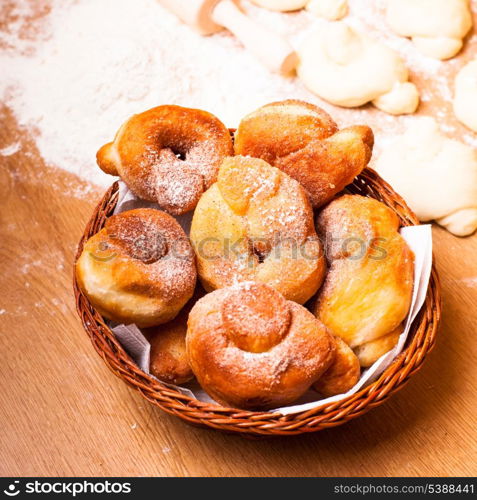 Fresh donats with sugar powder and prepared dough