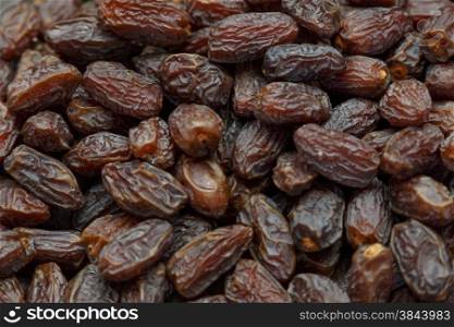 Fresh dried date fruits background in a market place