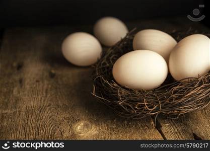 Fresh duck eggs in moody vintage style natural lighting set up