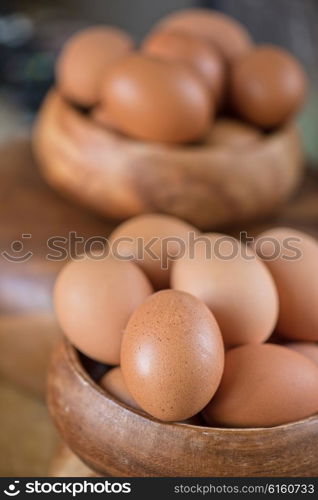 Fresh eggs at wooden plate . Fresh eggs at wooden plate closeup