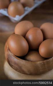 Fresh eggs closeup. Fresh eggs at wooden plate closeup