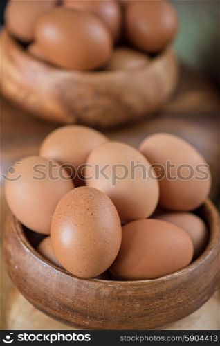 Fresh eggs . Fresh eggs at wooden plate closeup