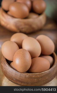 Fresh eggs . Fresh eggs at wooden plate closeup