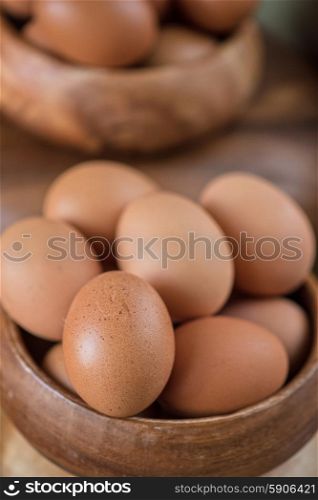 Fresh eggs . Fresh eggs at wooden plate closeup