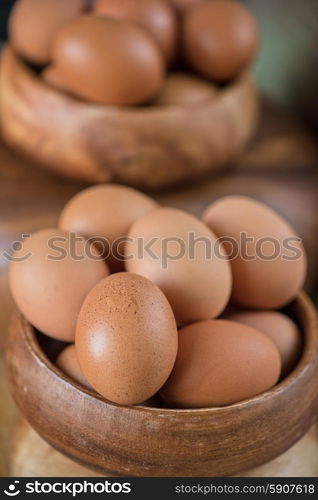 Fresh eggs . Fresh eggs at wooden plate closeup