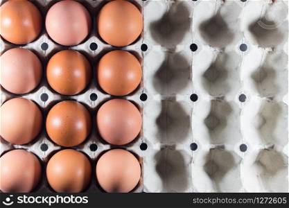 Fresh eggs from the farm in the panel white paper. Background eggs arranged in panels paper. Eggs and paper panel on white background.