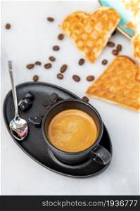 Fresh espresso coffee with coffee beans on white marble background
