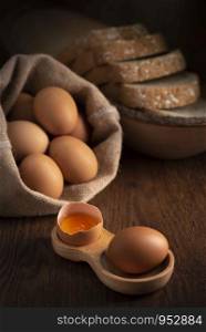 Fresh farm eggs on a wooden rustic background