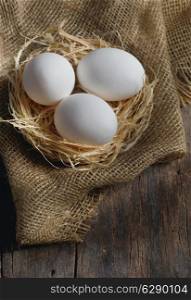 Fresh farm eggs on wooden background