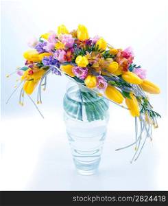 Fresh festive bouquet of colorful flowers in vase on white background