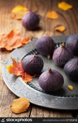 fresh figs and autumn leaves