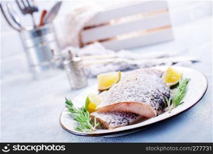 Fresh fish, raw cod fillets with rosemary and salt