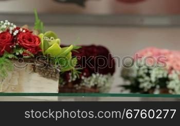Fresh Flower Baskets And Arrangements In Florist Shop, Closeup, Tracking Shot
