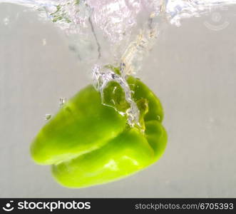 Fresh food fall into water creating interesting patterns with the bubbles caused.