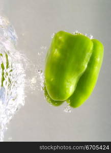 Fresh food fall into water creating interesting patterns with the bubbles caused.