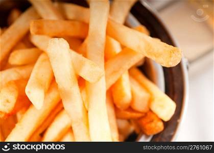 fresh french fries on a bucket extreme close up macro