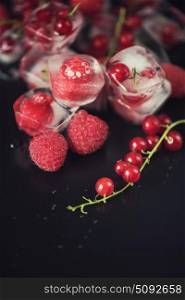 Fresh frozen berries raspberry and red currant. Frozen berries on wooden table