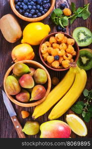 fresh fruit on the wooden table, autumn fruits