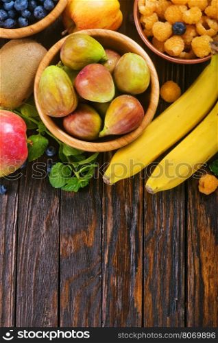 fresh fruit on the wooden table, autumn fruits
