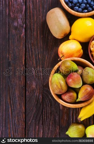 fresh fruit on the wooden table, autumn fruits