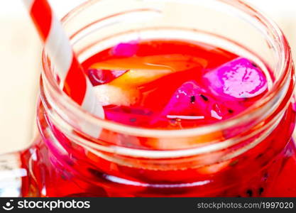 fresh fruit punch refreshing summer drink over white rustic wood table