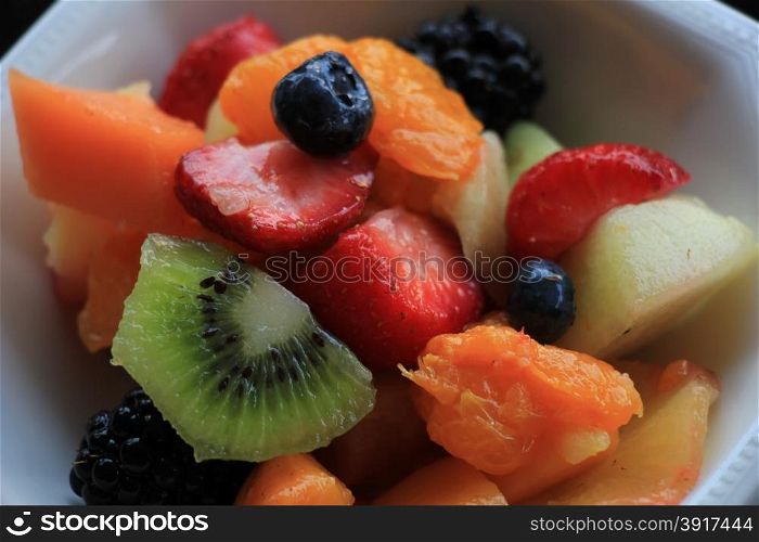 Fresh fruit salad in a white bowl
