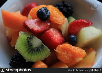 Fresh fruit salad in a white bowl
