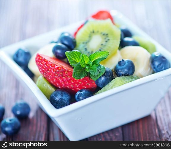 fresh fruit salad in the white bowl